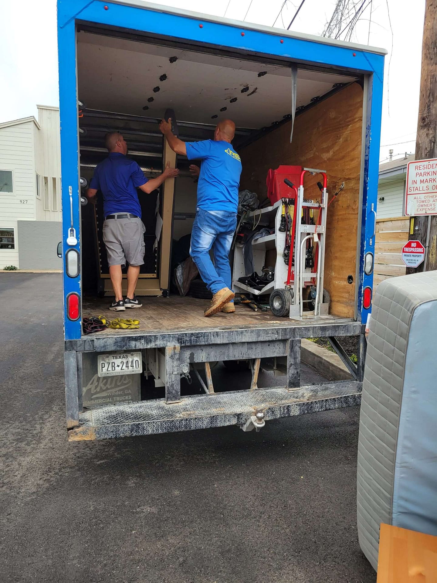 IREP team load junk in the truck in Austin great waste management solution for junk removal